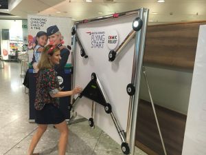 TV personality Caroline Flack playing on a Batak Reaction Game at a corporate event for British Airways.