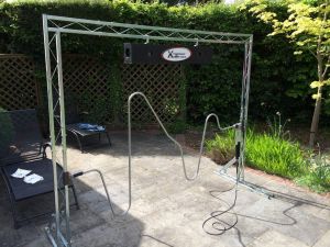 Giant Buzzer game set up in a garden for a birthday party event.