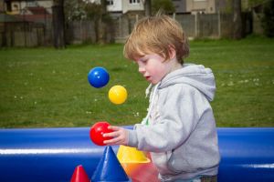 A boy playing with an air game on the Children's Play Zone