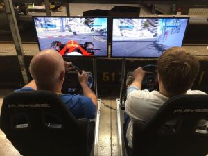 Guests Racing Against Each Other On Car Simulator